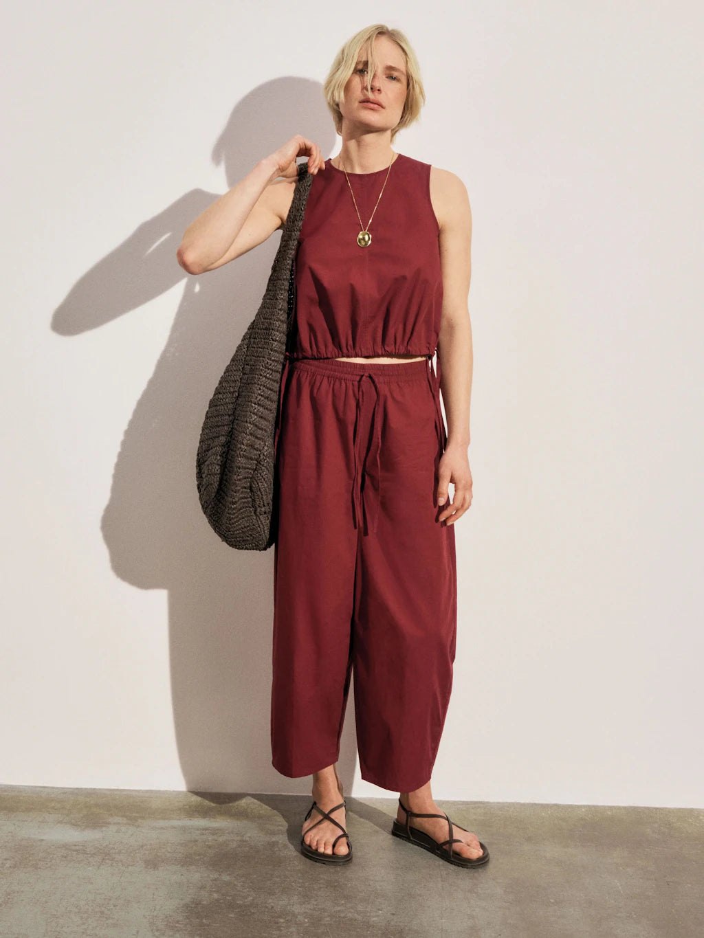 Maroon sleeveless cotton top.