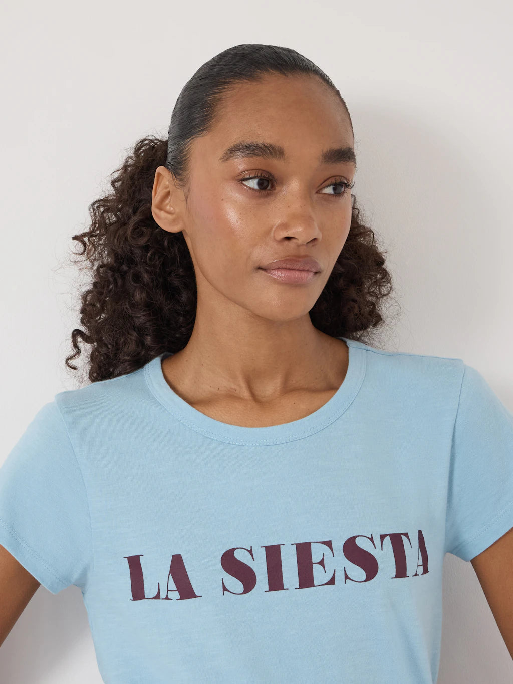 Light blue slub t-shirt with graphic print: LA SIESTA.