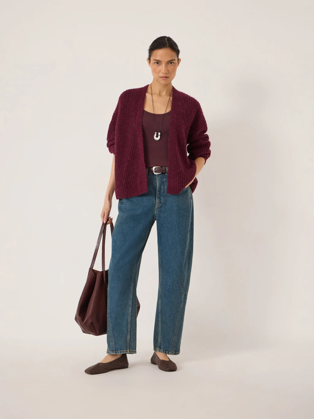 Faded blue tapered leg jeans.