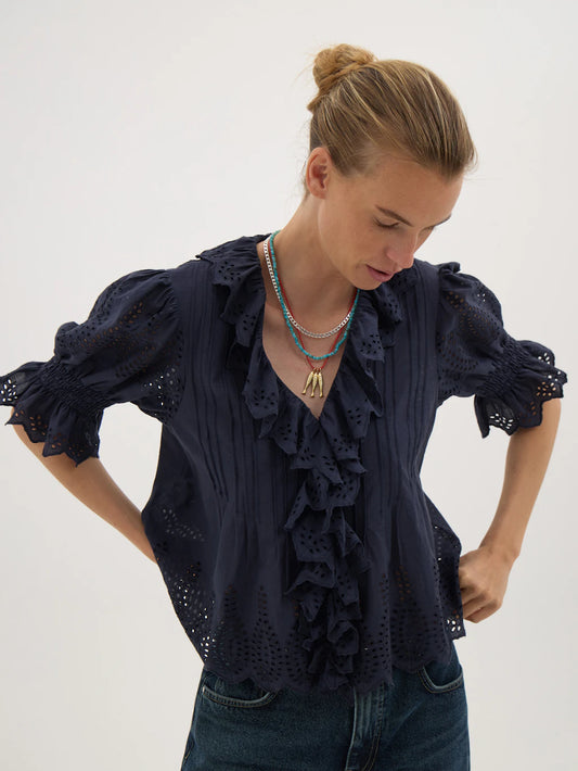 Navy broderie blouse.