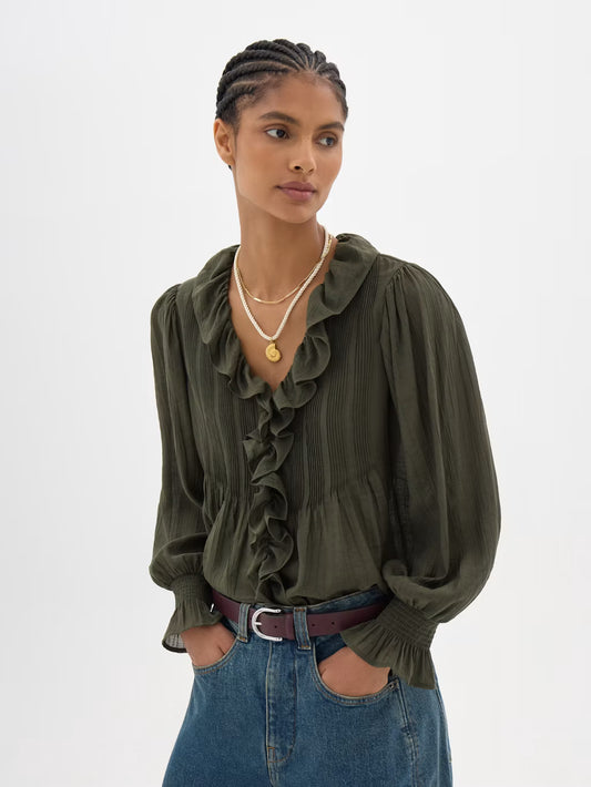 Olive ruffle blouse with long sleeves.