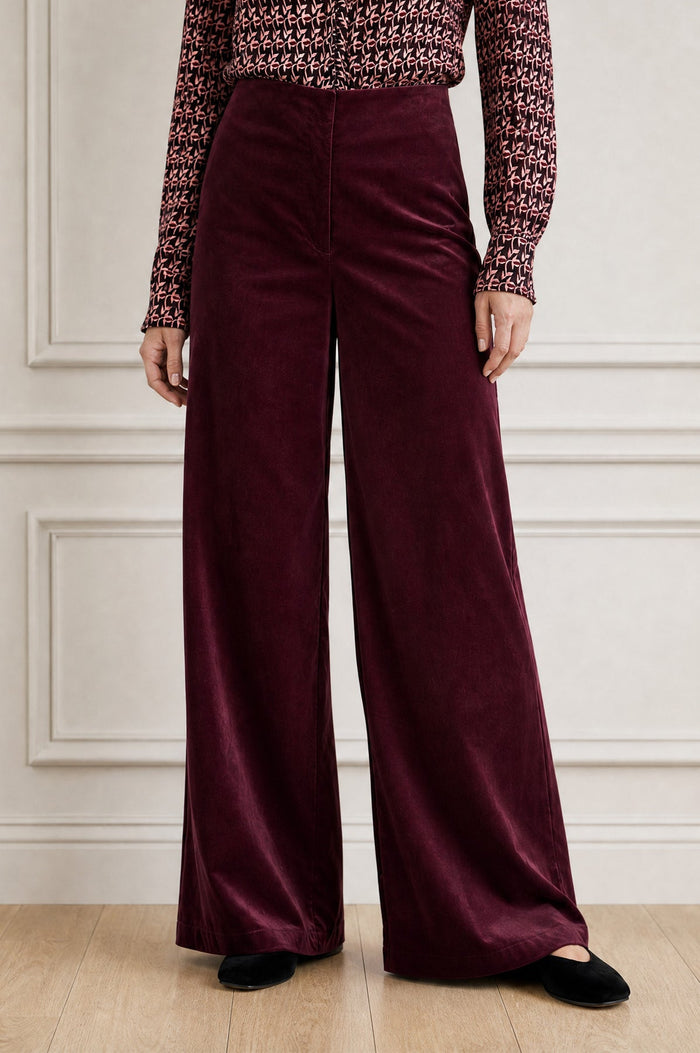Wide leg velvet burgundy trousers.