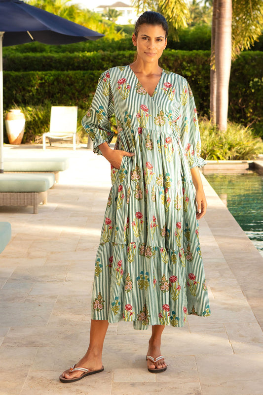 Green and white striped dress with floral print, V-neckline, and gathered waist.