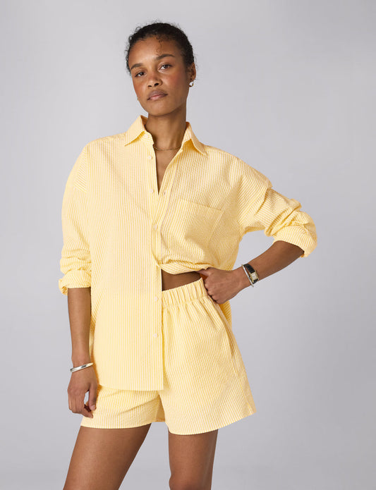 Yellow striped seersucker boxer shorts.