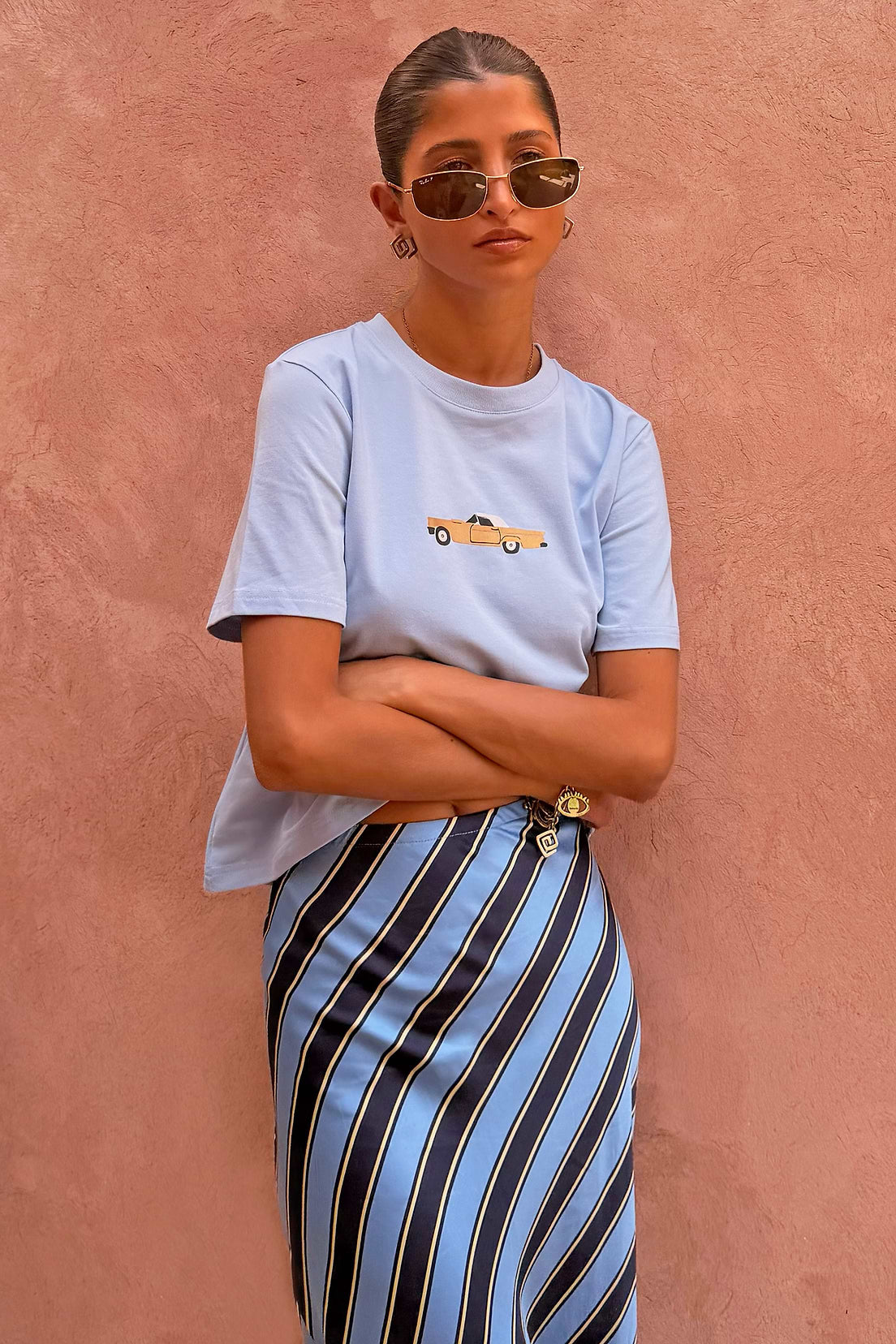 Pale blue t-shirt with card embroidery.