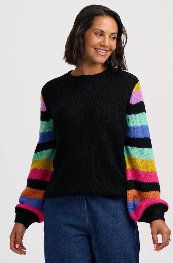 Black jumper with rainbow striped balloon sleeves.