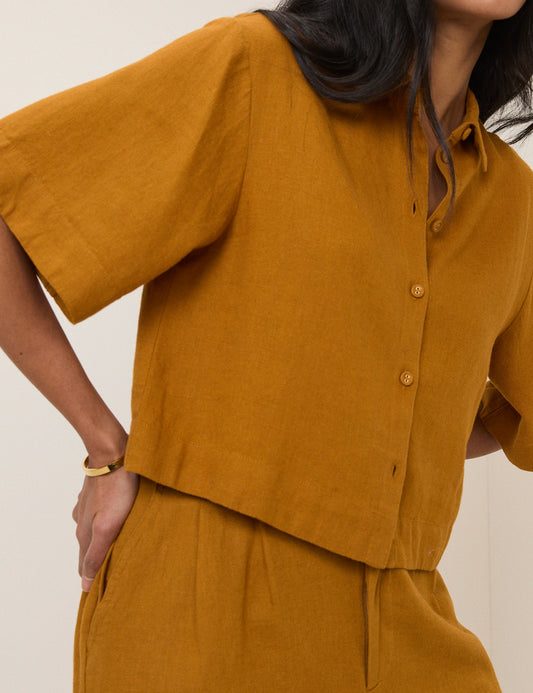 Mustard linen shirt.