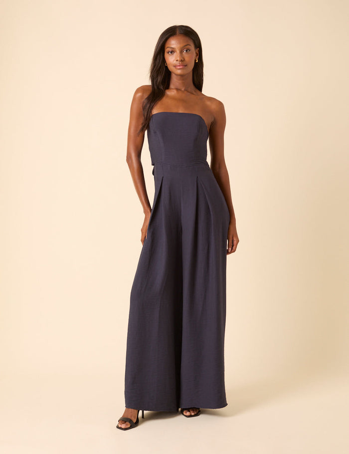 Navy wide leg bandeau jumpsuit with tie back.