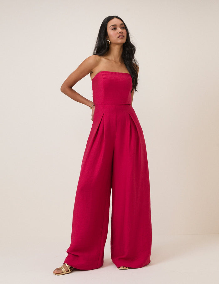 Deep bright pink bandeau jumpsuit with tie back.