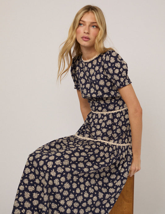 Navy floral midi dress with lace trim.