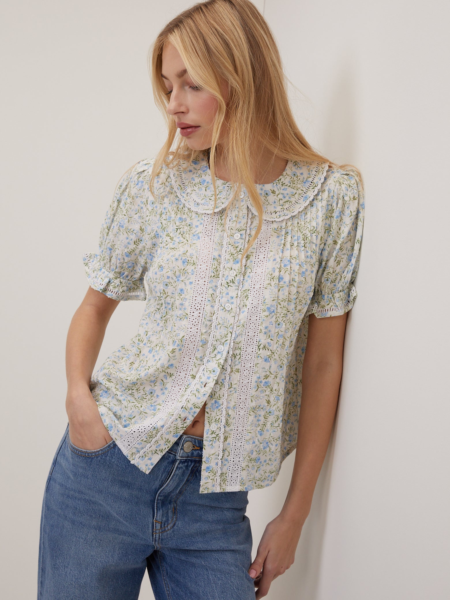 White floral blouse with Peter Pan collar.