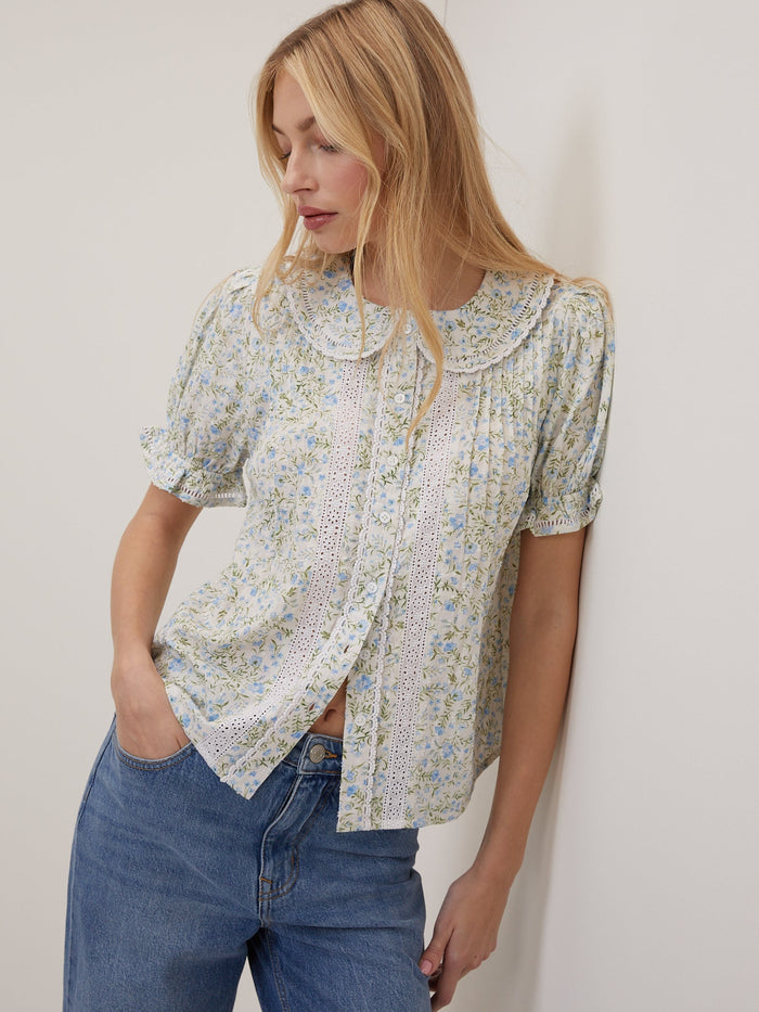 White floral blouse with Peter Pan collar.