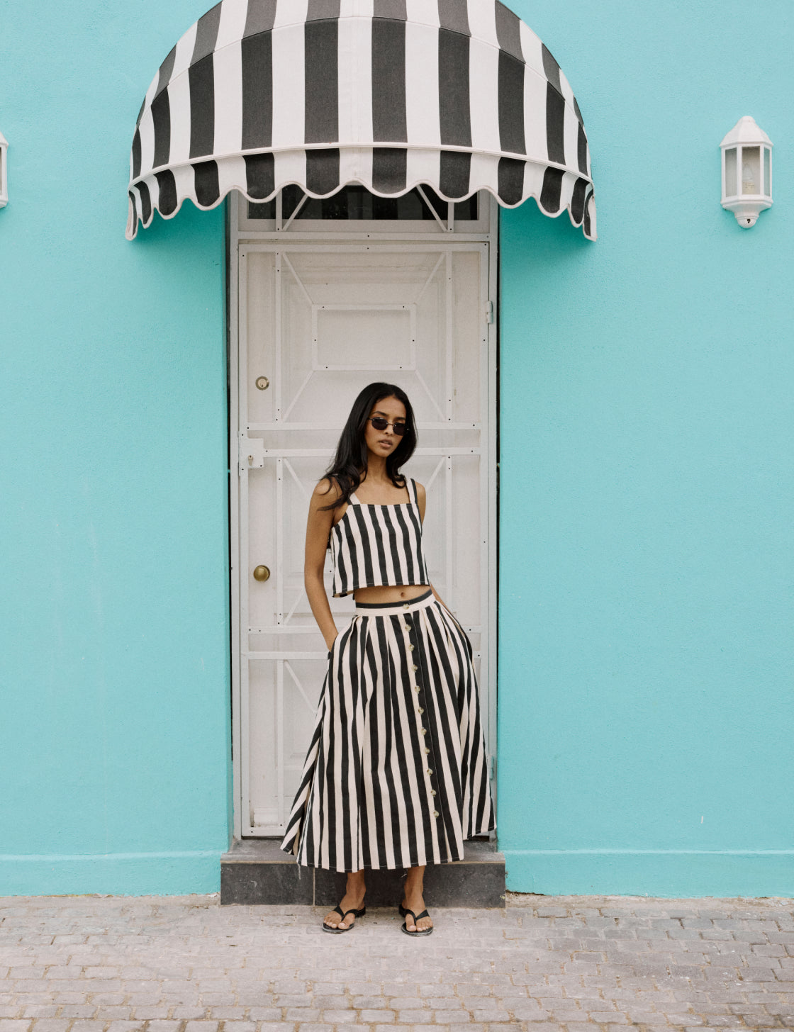 Black and white striped button midi skirt.
