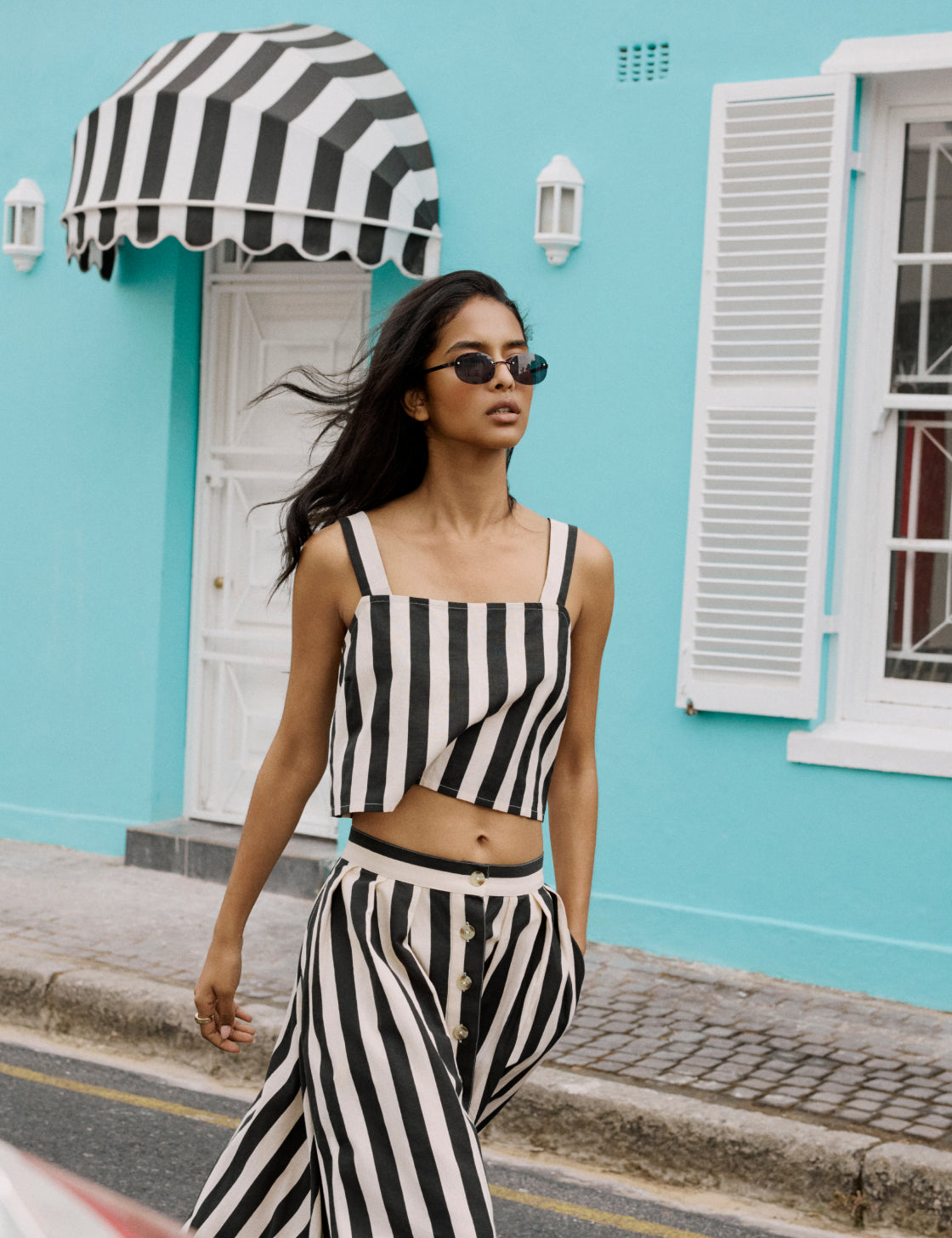 Black and white striped linen-blend vest top.
