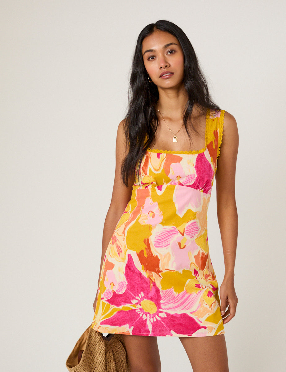 Pink and orange floral mini dress with lace straps.