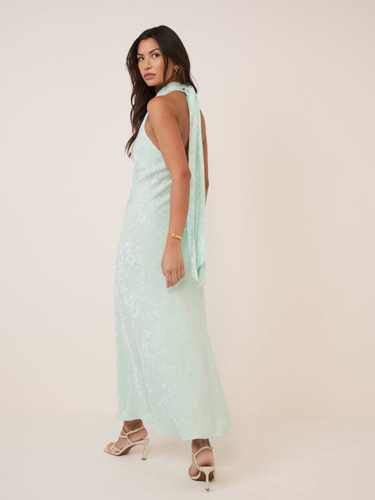 Mint green jacquard halterneck dress.