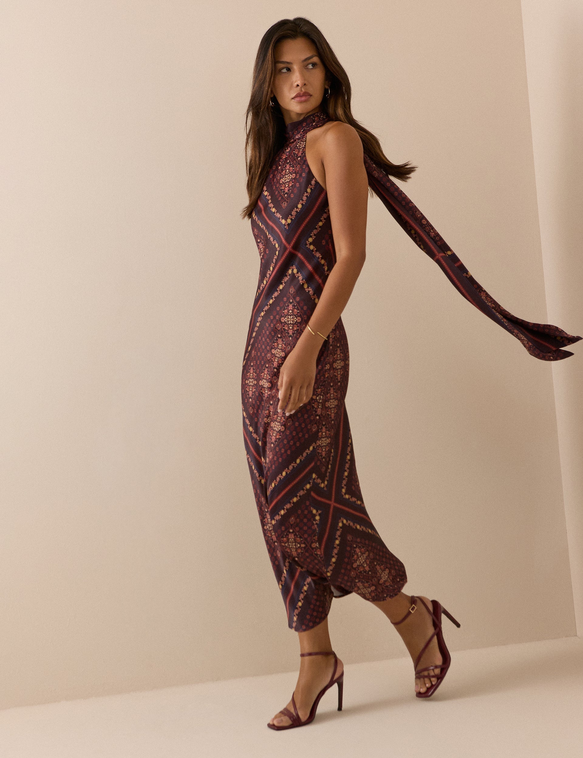 Paisley brown and red halterneck dress.