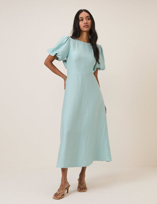 Light blue round neck puff sleeve midi dress with bow tie back.