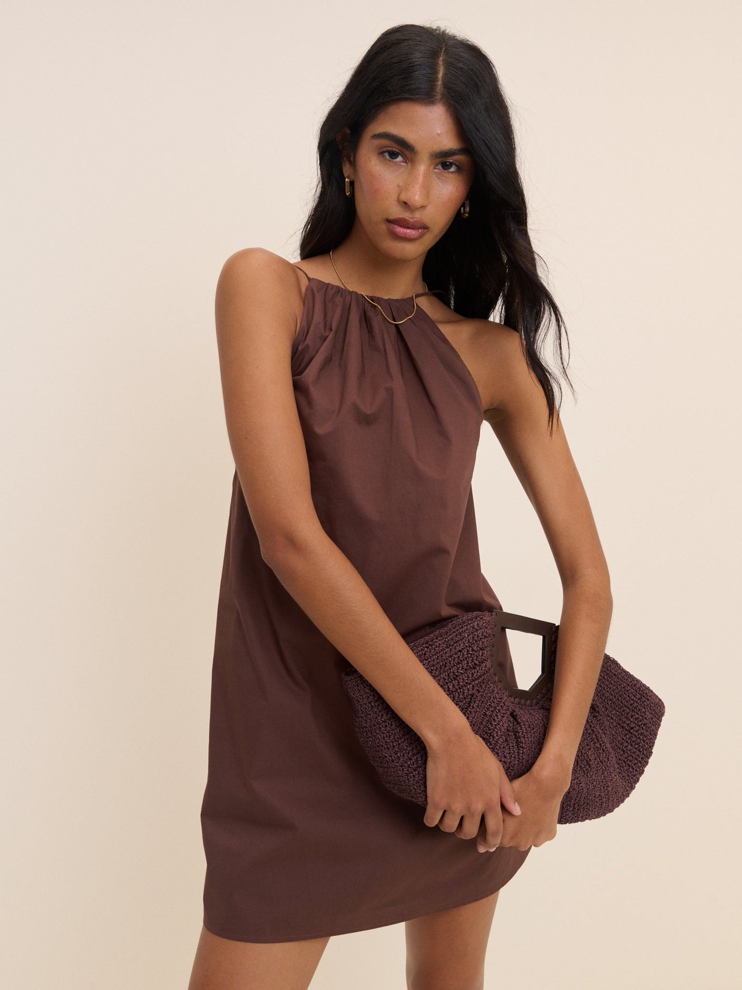 Chocolate brown regenerative cotton halterneck mini dress with open back.