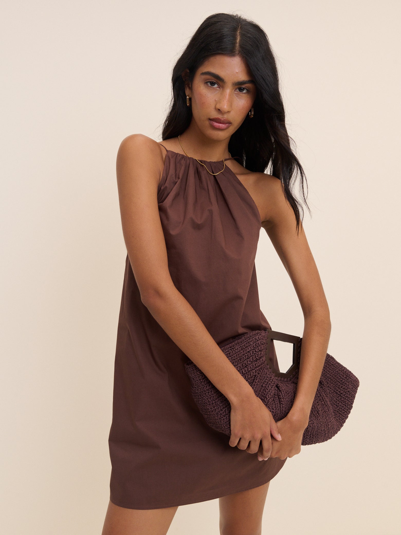 Chocolate brown regenerative cotton halterneck mini dress with open back.
