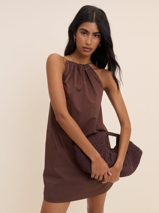 Chocolate brown regenerative cotton halterneck mini dress with open back.