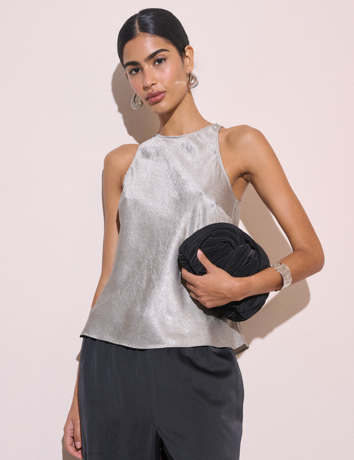 Silver sleeveless satin top.