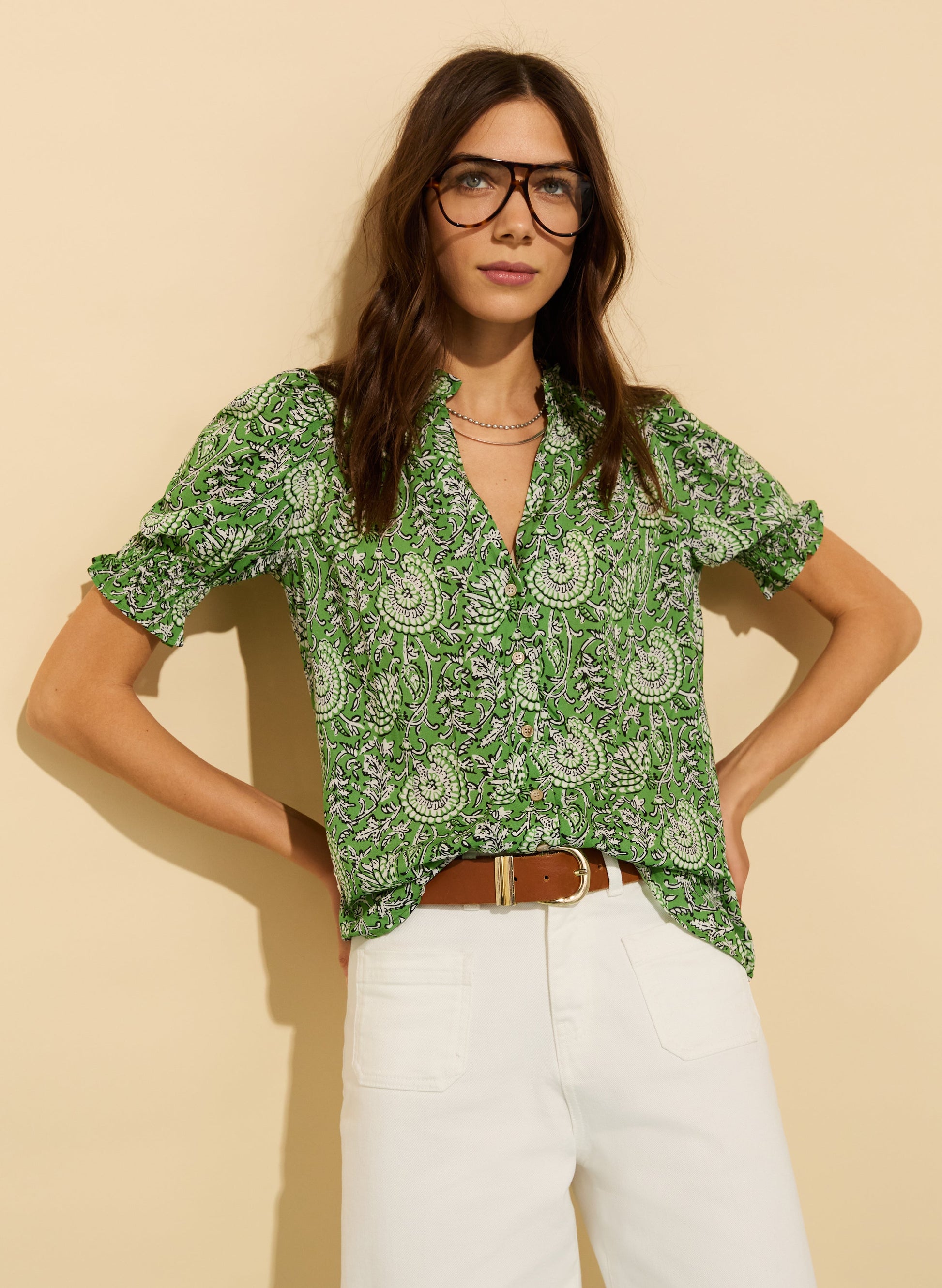 Green printed blouse with short sleeves.