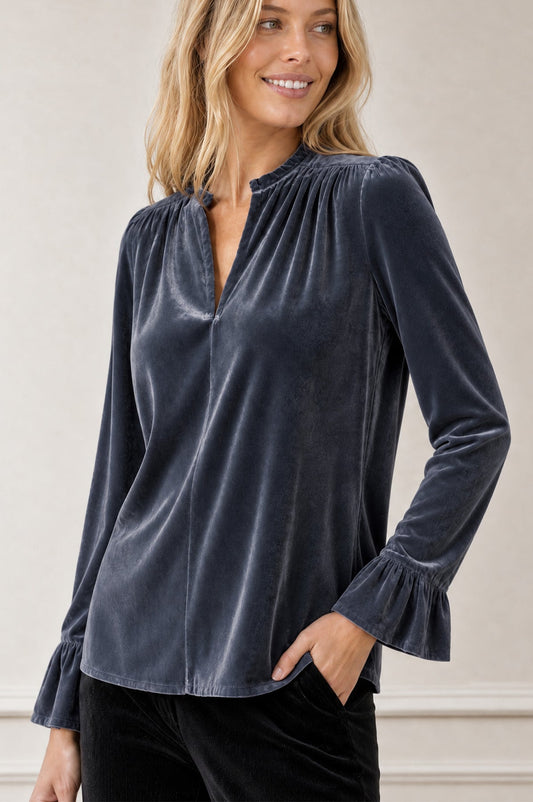 Grey-blue velvet blouse with pie crust collar and flowing sleeves.