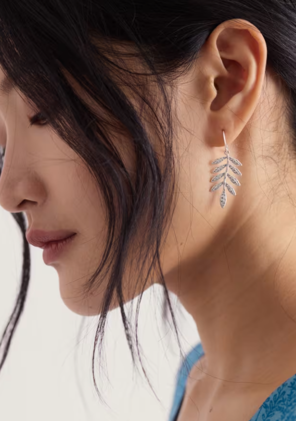Silver leaf shaped drop earrings.