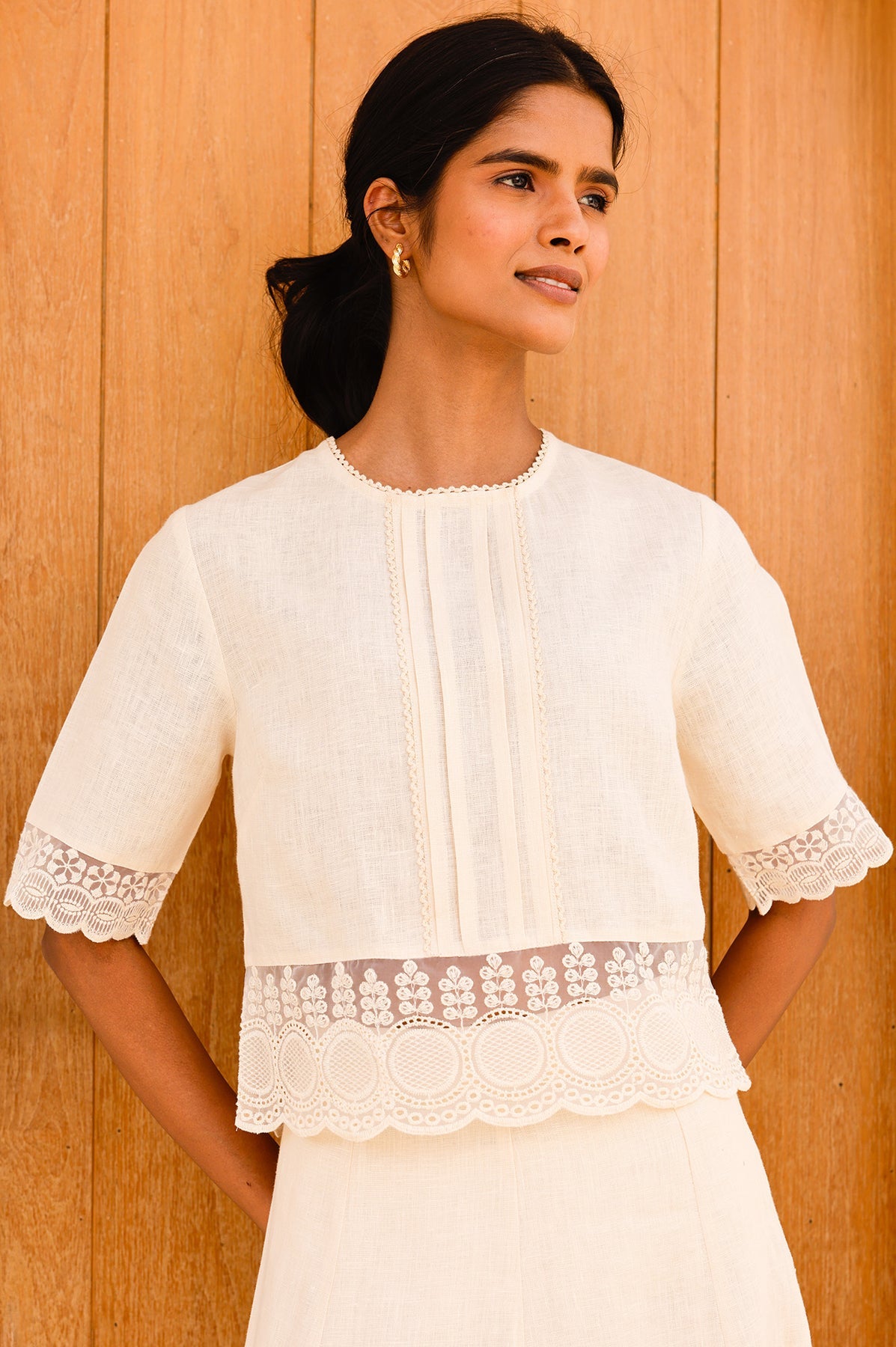 Cream lace cropped blouse.