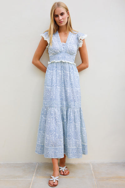 Organic cotton midi summer dress in blue and white floral pattern.