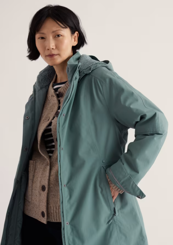 Light teal raincoat.