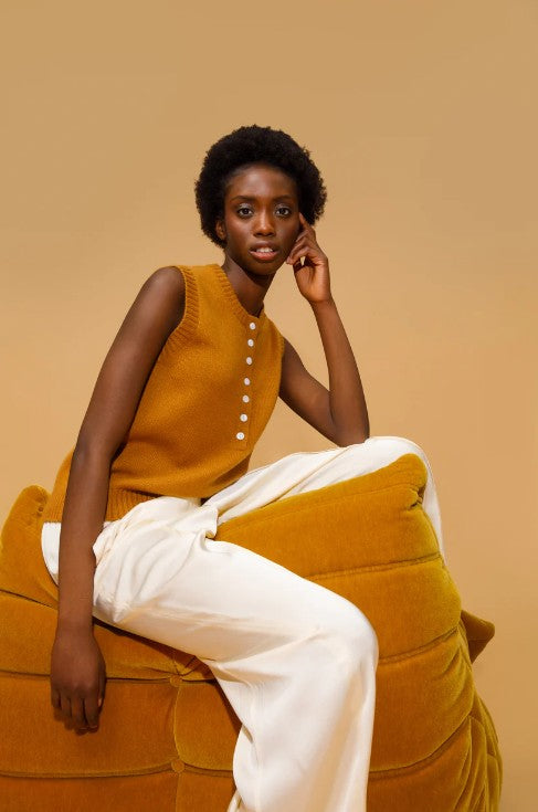 Amber coloured cashmere button down vest.