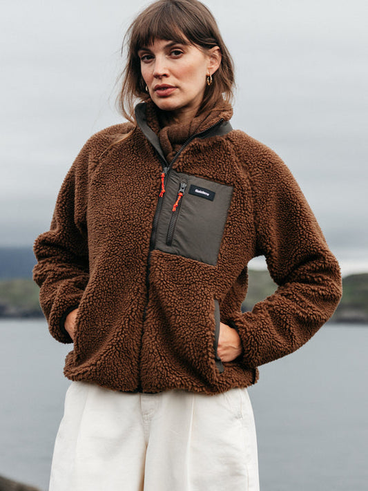 Brown recycled polyester fleece with black zip pocket and Finisterre logo.