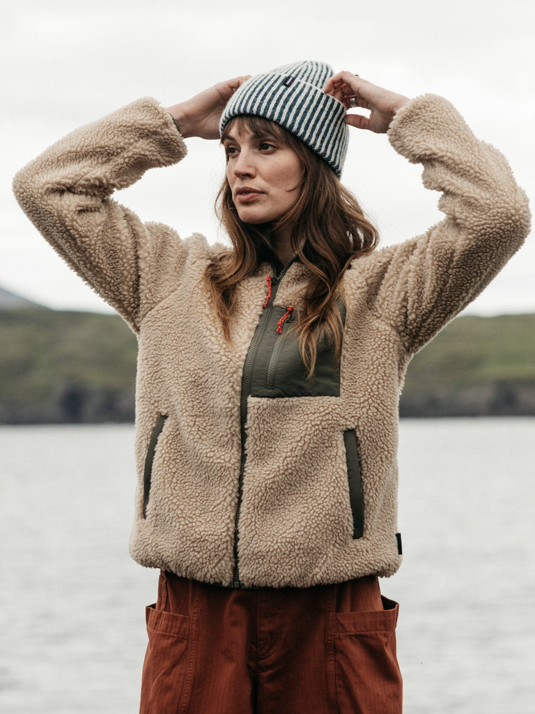 Oatmeal recycled polyester fleece with olive zip pocket.
