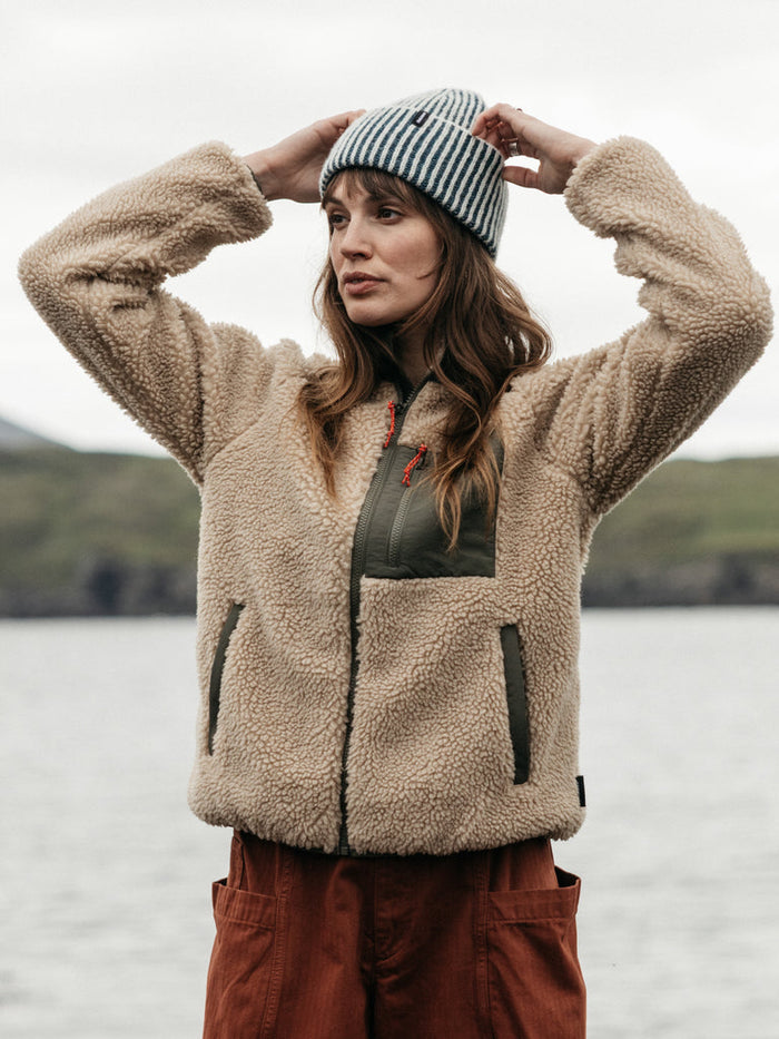 Oatmeal recycled polyester fleece with olive zip pocket.