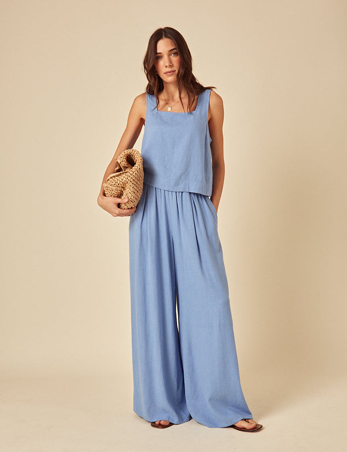Powder blue wide leg linen trousers.