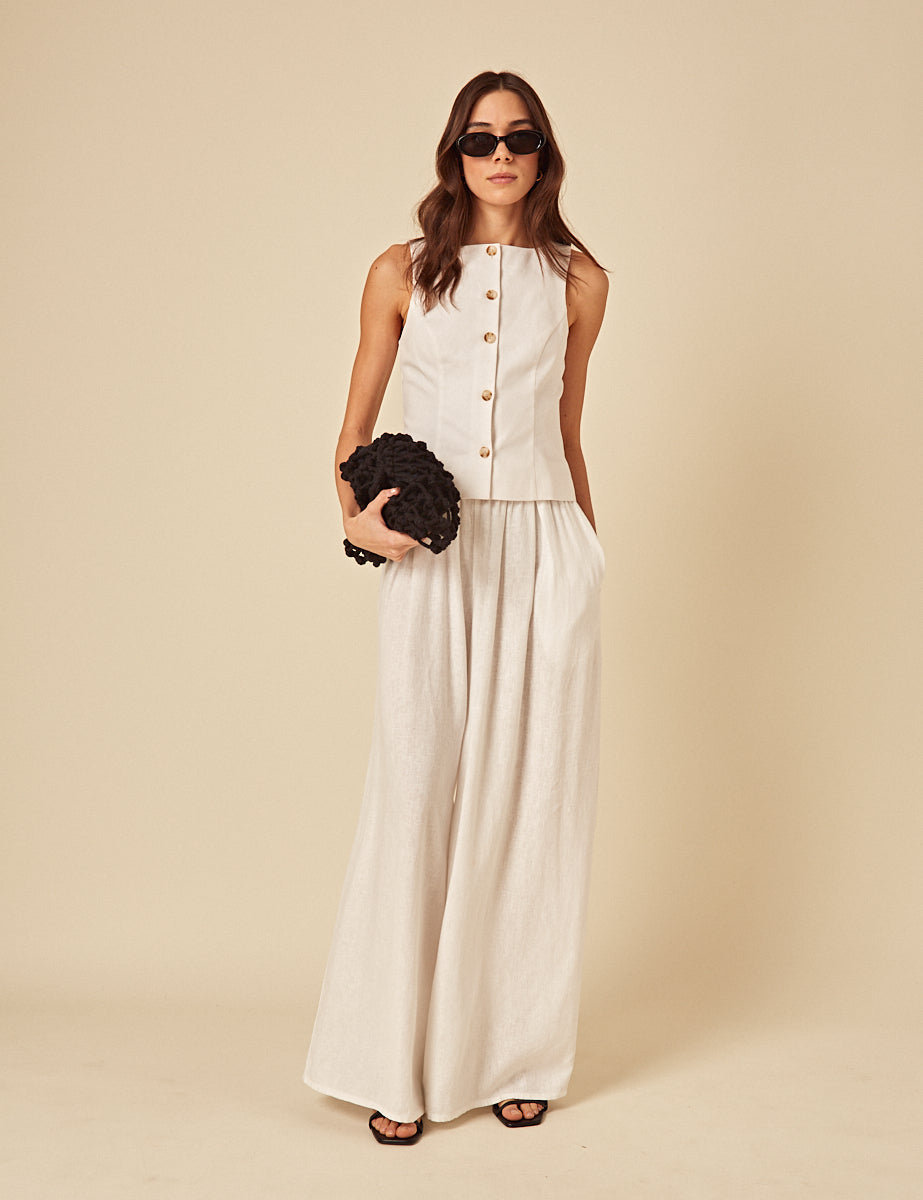 White linen-blend wide leg trousers.