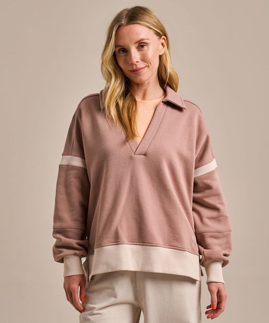 Beige and cream V-neck collared organic cotton sweatshirt.