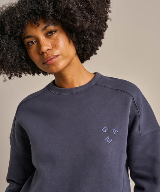 Soft navy sweatshirt with "BAM" embroidery at the chest.