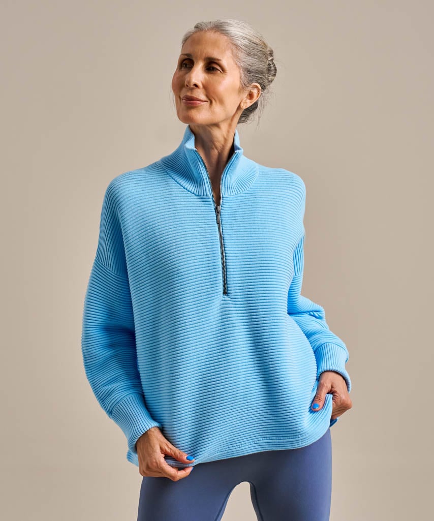 Bright blue activewear half zip jumper.