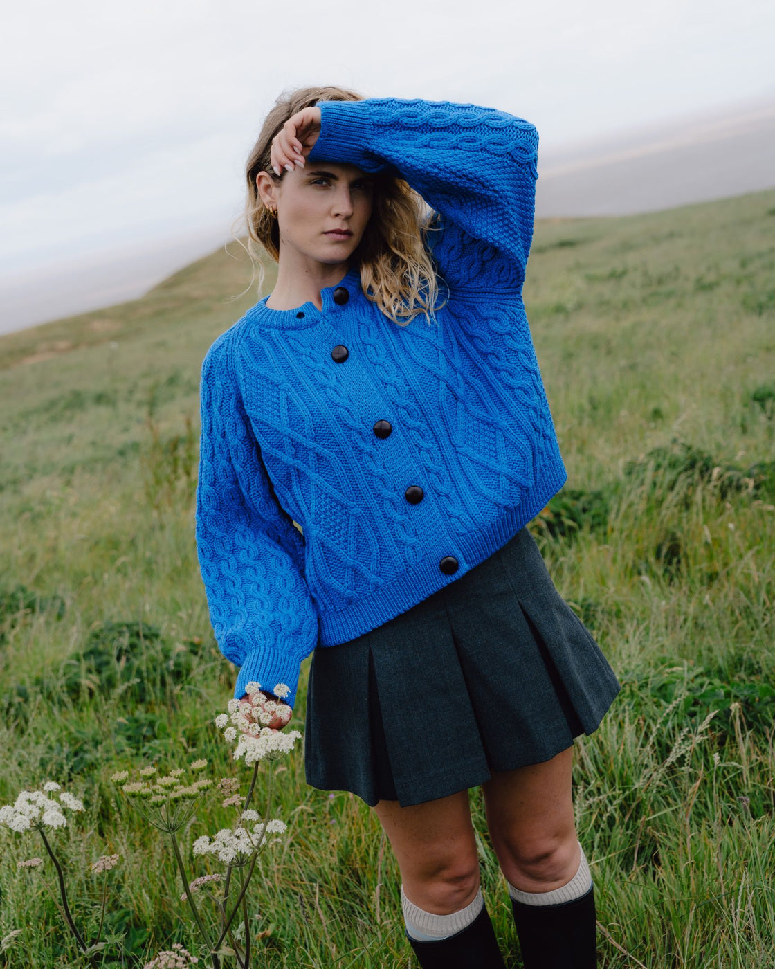 Cobalt blue merino cable knit cardigan with big buttons.