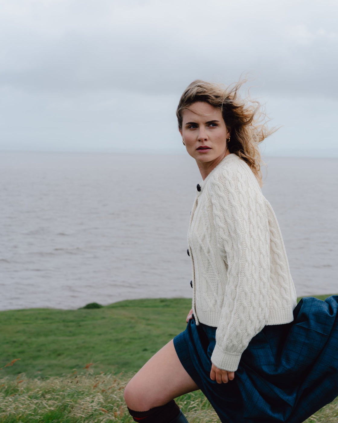 Cream cable knit merino cardigan.