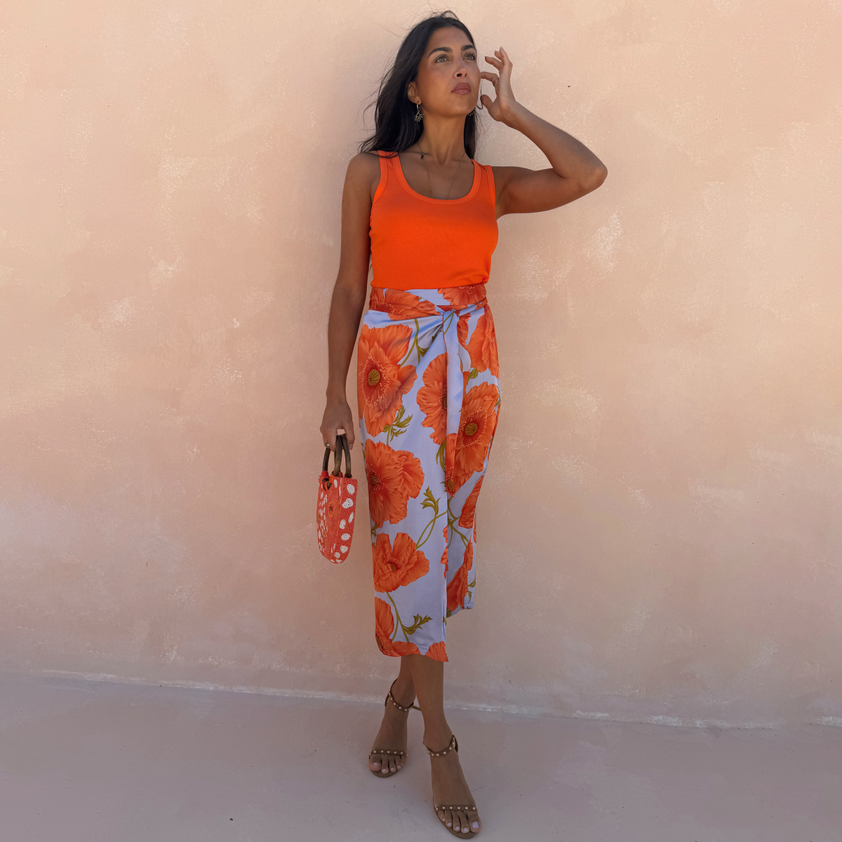 Blue skirt with orange poppy pattern.