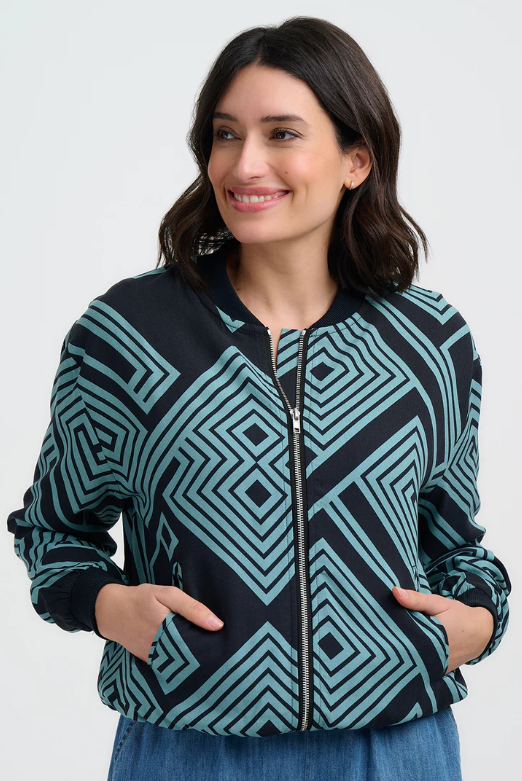 Black zip-front jacket with teal geometric pattern and ribbed cuffs