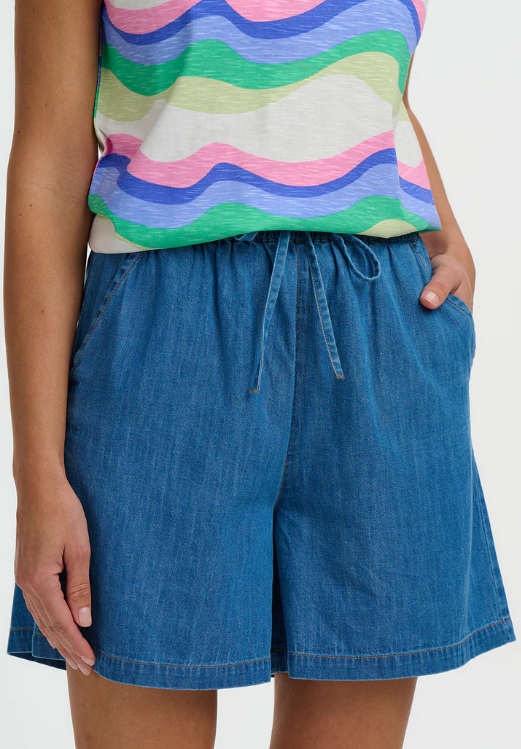 Mid-blue unwashed denim shorts with a relaxed fit and drawstring waist