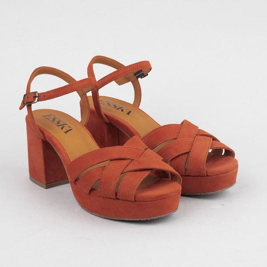 Rust-orange suede platform sandals.