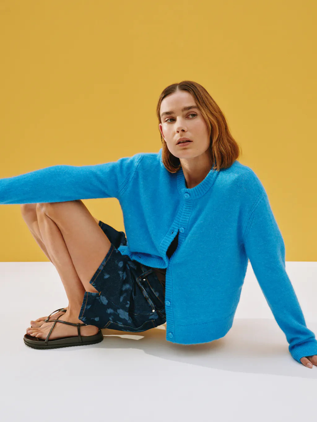 Bright blue round neck cardigan.