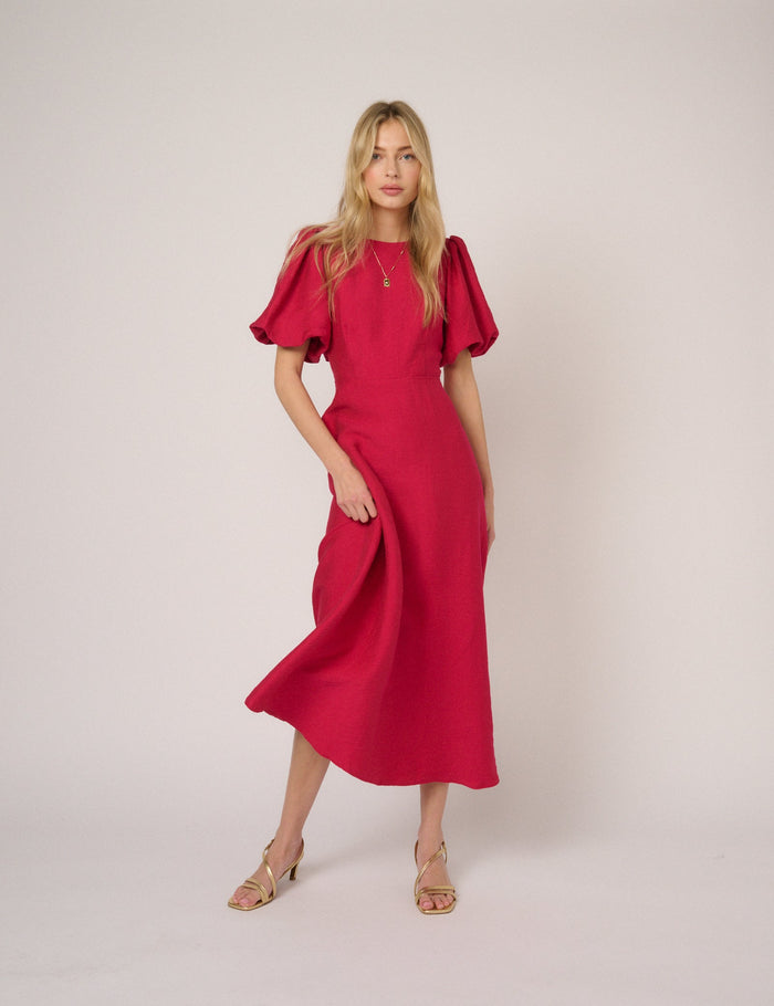 Bright pink round neck puff sleeve midi dress.