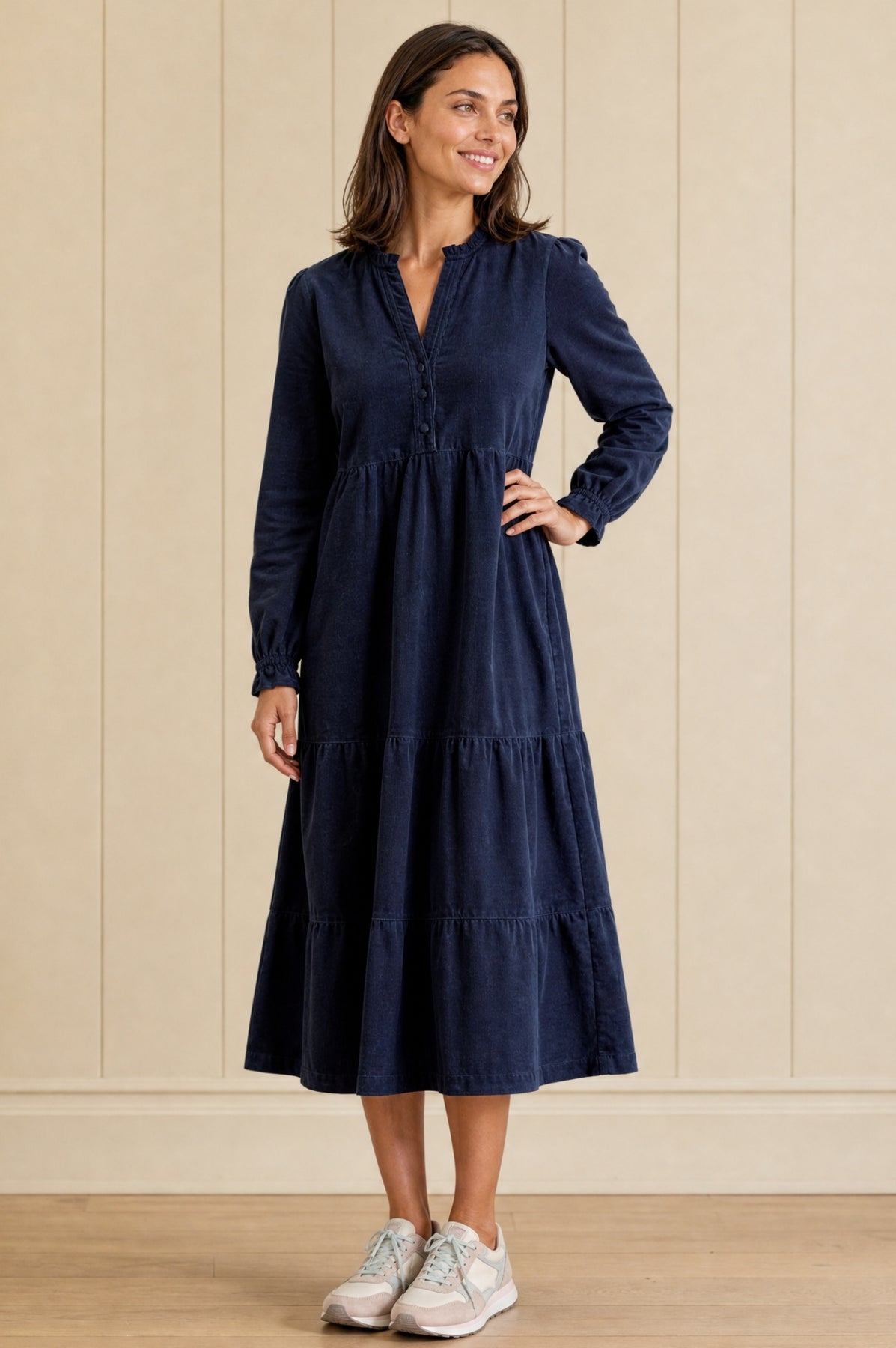 Navy blue corduroy midi dress with long sleeves.